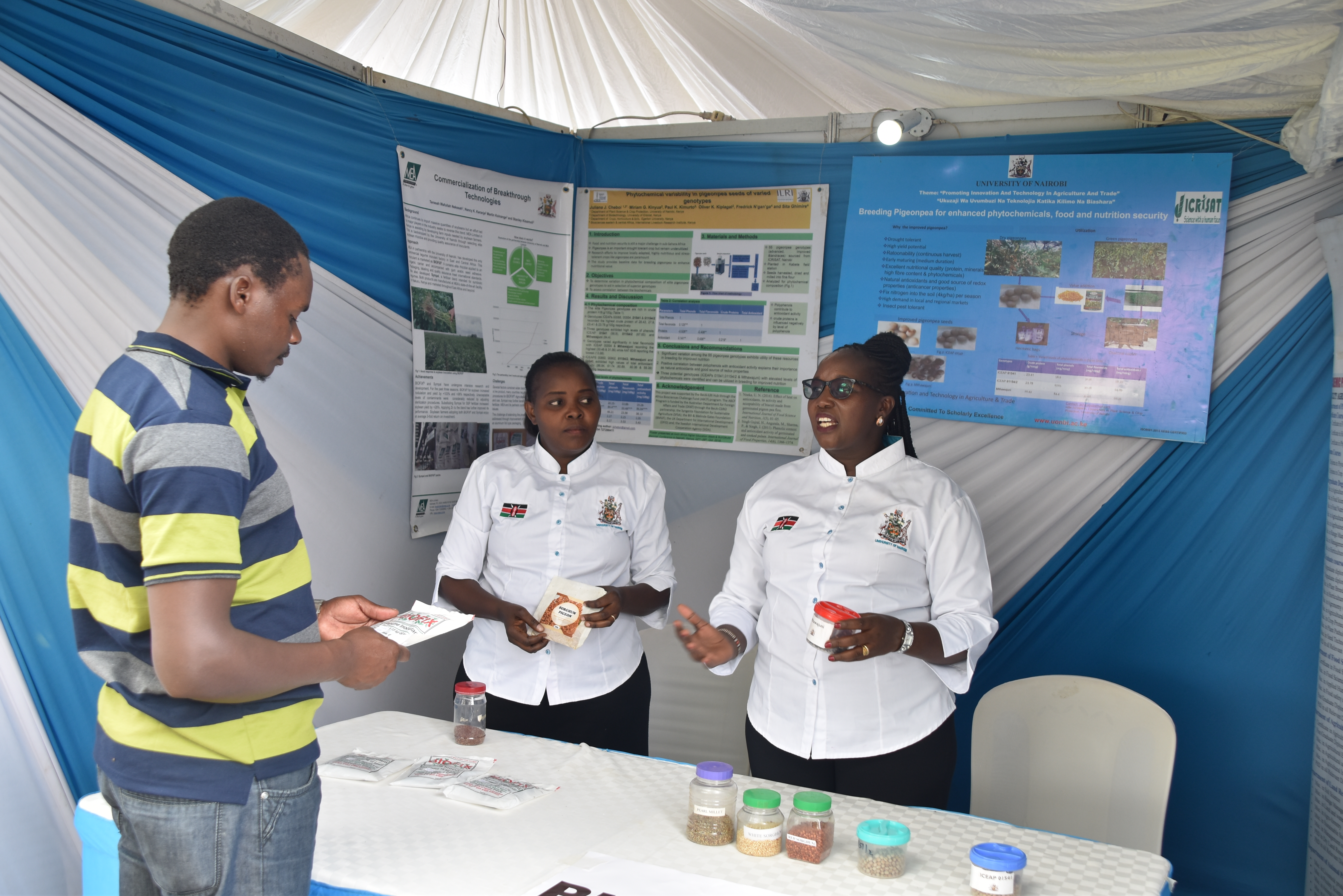Dr. Juliana Cheboi and Catherine Mueni   showcasing their innovation of pigeonpea genotypes