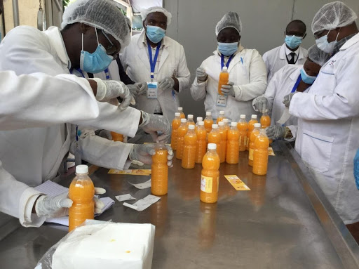 Trainees packaging the ready-to-drink juice from their practical training session