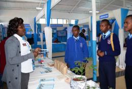 CAVS participant explaining to some of  Students who visited the stand the importance of Agricultural Innovations, food safety and quality .